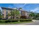 Building exterior showcasing landscaping and gated entrance at 4221 W Spruce St # 1212, Tampa, FL 33607