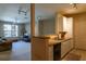 Open kitchen with white cabinets and black appliances at 4221 W Spruce St # 1212, Tampa, FL 33607