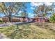 Two-unit house with carport and yard at 5711 S Coolidge Ave, Tampa, FL 33616