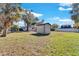 Backyard with shed and open grassy area at 5711 S Coolidge Ave, Tampa, FL 33616