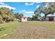 Backyard view showcasing a shed and ample green space at 5711 S Coolidge Ave, Tampa, FL 33616