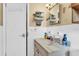 Bathroom with vanity, mirror and access to linen closet at 5711 S Coolidge Ave, Tampa, FL 33616