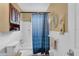 Clean bathroom with shower/tub combo and updated vanity at 5711 S Coolidge Ave, Tampa, FL 33616