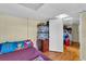 Charming bedroom with wood floors and access to hallway at 5711 S Coolidge Ave, Tampa, FL 33616