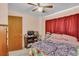 Spacious bedroom with double bed and ceiling fan at 5711 S Coolidge Ave, Tampa, FL 33616