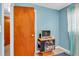 Bedroom with tv stand and access to hallway at 5711 S Coolidge Ave, Tampa, FL 33616
