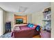 Comfortable bedroom with bay window and wood floors at 5711 S Coolidge Ave, Tampa, FL 33616