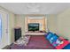 Spacious bedroom with bay window and TV at 5711 S Coolidge Ave, Tampa, FL 33616