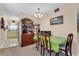 Dining area with a table, chairs, and wooden cabinet at 5711 S Coolidge Ave, Tampa, FL 33616
