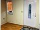 Light-filled entryway with wood flooring and a stained-glass door at 5711 S Coolidge Ave, Tampa, FL 33616