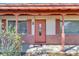 Front porch with brick and red door at 5711 S Coolidge Ave, Tampa, FL 33616