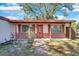 Brick ranch home with covered porch and walkway at 5711 S Coolidge Ave, Tampa, FL 33616