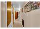 Long hallway with light walls and doors to other rooms at 5711 S Coolidge Ave, Tampa, FL 33616