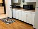 White kitchen with ample counter space and cabinets at 5711 S Coolidge Ave, Tampa, FL 33616