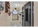 Galley kitchen with white cabinets and appliances at 5711 S Coolidge Ave, Tampa, FL 33616