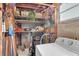 Small laundry room with washer, shelving, and storage at 5711 S Coolidge Ave, Tampa, FL 33616