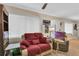 Living room with red couch and side table at 5711 S Coolidge Ave, Tampa, FL 33616