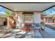 Cozy patio under carport with table and chairs at 5711 S Coolidge Ave, Tampa, FL 33616