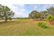 Spacious backyard with pond view and lush landscaping at 6516 Salt Creek Ave, Apollo Beach, FL 33572