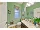 Small bathroom with a sink, toilet, and shower at 6516 Salt Creek Ave, Apollo Beach, FL 33572