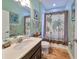 Bathroom with tub shower combo and vanity at 6516 Salt Creek Ave, Apollo Beach, FL 33572