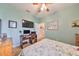 Bedroom with a bed, desk, and tv at 6516 Salt Creek Ave, Apollo Beach, FL 33572