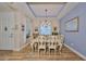 Spacious dining area with hardwood floors and large windows at 6516 Salt Creek Ave, Apollo Beach, FL 33572