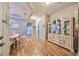 Bright dining room with elegant chandelier and hardwood floors at 6516 Salt Creek Ave, Apollo Beach, FL 33572