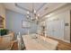 Formal dining room, hardwood floors, and a lovely chandelier at 6516 Salt Creek Ave, Apollo Beach, FL 33572