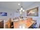 Formal dining area with a large wooden table and six chairs at 6516 Salt Creek Ave, Apollo Beach, FL 33572