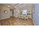 Bright dining room with hardwood floors and chandelier at 6516 Salt Creek Ave, Apollo Beach, FL 33572