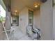 Covered porch with seating for relaxing at 6516 Salt Creek Ave, Apollo Beach, FL 33572