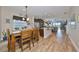 Open kitchen with island and stainless steel appliances at 6516 Salt Creek Ave, Apollo Beach, FL 33572