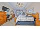 Spacious main bedroom with a king-size bed and ensuite bathroom at 6516 Salt Creek Ave, Apollo Beach, FL 33572