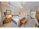 Spacious main bedroom with a king-size bed and ensuite bathroom at 6516 Salt Creek Ave, Apollo Beach, FL 33572