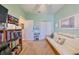 Home office with a futon and bookcase at 6516 Salt Creek Ave, Apollo Beach, FL 33572