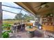 Screened porch with hot tub, grill, and dining area at 6516 Salt Creek Ave, Apollo Beach, FL 33572