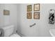 Small bathroom with pedestal sink and decorative framed art at 835 7Th N Ave, St Petersburg, FL 33701
