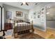 Guest bedroom with brass bed frame and hardwood floors at 835 7Th N Ave, St Petersburg, FL 33701