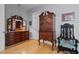 Bedroom with antique wooden furniture and hardwood floors at 835 7Th N Ave, St Petersburg, FL 33701