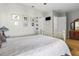 Bright bedroom with brass bed frame and wood floors at 835 7Th N Ave, St Petersburg, FL 33701