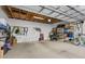 Spacious garage with ample storage shelving and overhead storage at 835 7Th N Ave, St Petersburg, FL 33701