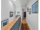 Upstairs hallway with wood floors and built-in shelves at 835 7Th N Ave, St Petersburg, FL 33701