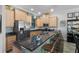 Modern kitchen with island, granite counters & stainless steel appliances at 835 7Th N Ave, St Petersburg, FL 33701