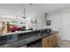 Kitchen with granite countertops and island overlooking living area at 835 7Th N Ave, St Petersburg, FL 33701