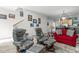 Open living space with gray recliners and red sofa at 835 7Th N Ave, St Petersburg, FL 33701