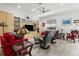 Living room with red sofa, gray recliners, and built-in shelving at 835 7Th N Ave, St Petersburg, FL 33701
