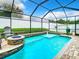 Refreshing screened pool and patio with fire pit at 10713 Shady Preserve Dr, Riverview, FL 33579