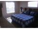 Spacious bedroom with a king-size bed and window at 12172 Wild Acres Rd, Largo, FL 33773