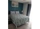 Bedroom with a seashell bedding and teal walls at 12172 Wild Acres Rd, Largo, FL 33773